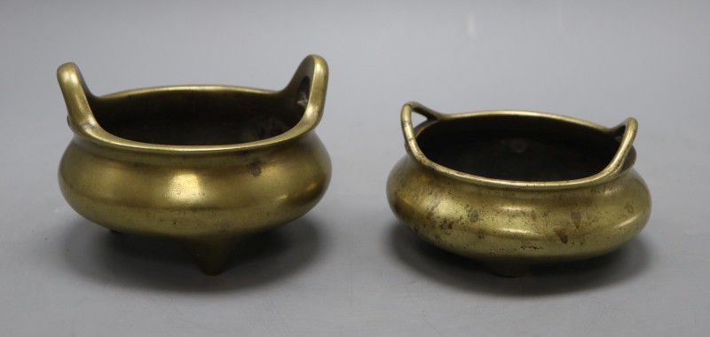 Two Chinese bronze tripod censers with seal marks, tallest 9cm